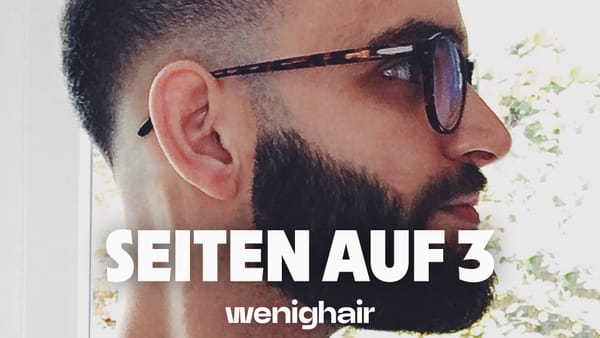 Markantes Profil mit 3mm Haarschnitt und Übergang, charakteristischer Vollbart und Designerbrille